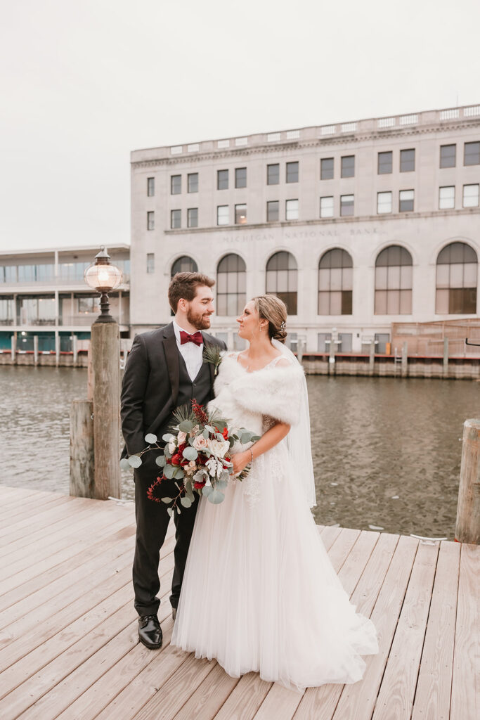 bride and groom portraits on the Black River in Port Huron