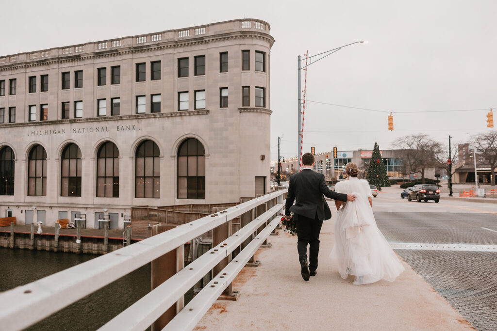 bride and groom portraits on the Black River in Port Huron