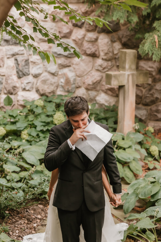 Groom getting emotional reading private vows