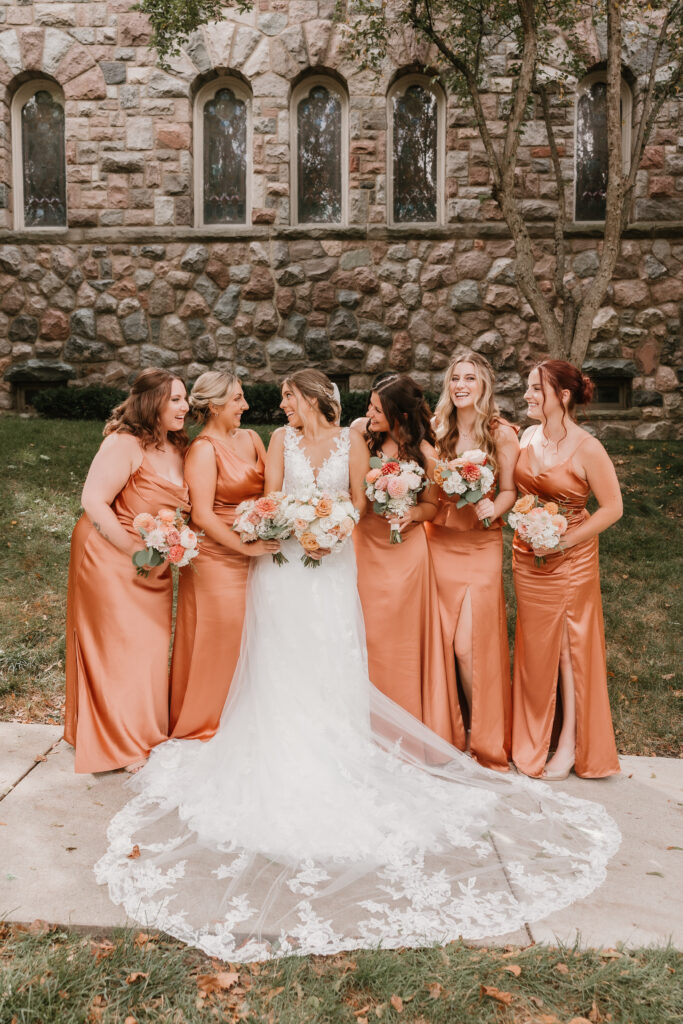 Bride and Bridesmaids laughing, excited for wedding