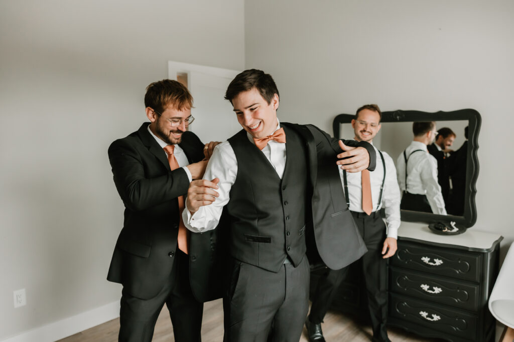 Groom and groomsmen getting ready together at wedding, The Collins Off Main, Chelsea, Ann Arbor