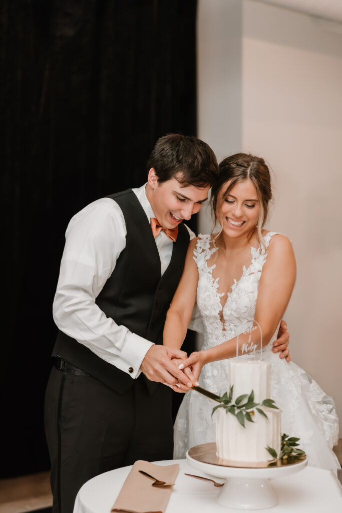 Bride and Groom cutting cake, Michigan wedding venue, Chelsea, Ann Arbor, The Collins Off Main