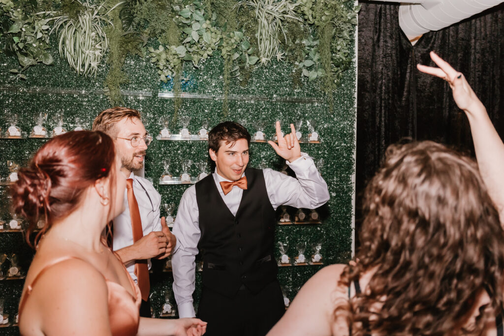 Groom and friends dancing at Michigan wedding, The Collins Off Main, Chelsea, Ann Arbor